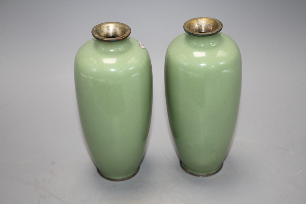 A pair of Japanese late Meiji period cloisonne vases, decorated with flowers on a celadon green ground, height 15cm, with original box